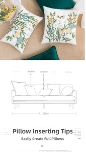 Detail showing various sizes of floral embroidery cotton canvas pillows on a sofa