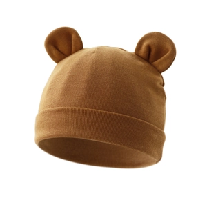 Close-up of ginger yellow baby beanie with round bear ears and folded brim texture