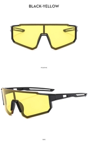 Detail view of black outdoor sports cycling glasses with yellow night vision lenses