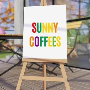 Mockup of white mailbox sign with Sunny Coffees lettering on a light wooden easel stand