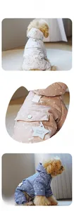 Detail view of quilted dog winter jumpsuit with starry patterns and decorative star tags