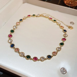 Detail of colorful crystal bracelet with vintage gold setting and adjustable lobster clasp
