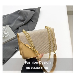 Detail of champagne gold chain bag showing woven texture and glossy metallic leather panel