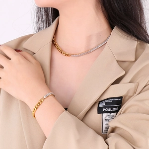 Close-up of gold Cuban chain necklace and bracelet set featuring sparkling zircon stones