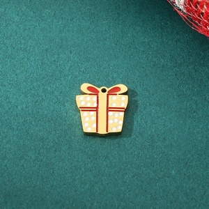 Detailed view of red and gold gift box charm pendant for Christmas jewelry DIY