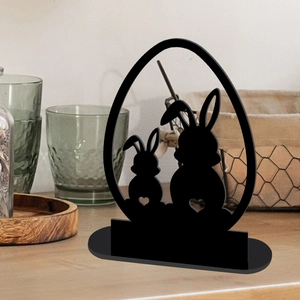 Detailed close-up of a black acrylic Easter bunny silhouette in an egg-shaped frame ornament