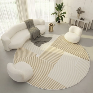 Detail view of round geometric minimalist carpet with beige and white拼接 design in living room
