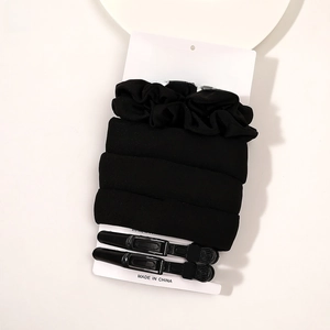 Detail view of black foam heatless hair curler set with two clips on display card