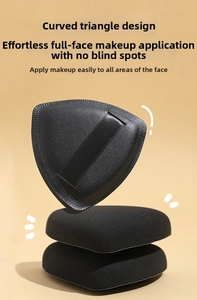 Detailed view of three black triangular flocking powder puffs with leather handles