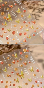 Macro detail of M-1065 5D embossed nail stickers featuring butterflies and floral designs