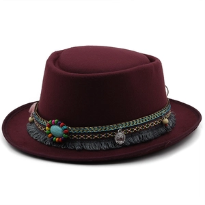 Flat top burgundy wool fedora hat with ethnic beads, turquoise and fringe tassels