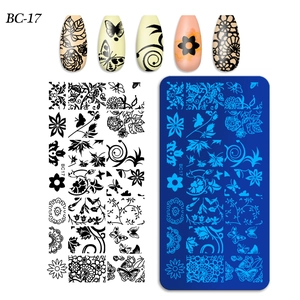 Nail art stamping plate set with rose, butterfly, and lace patterns for DIY manicure