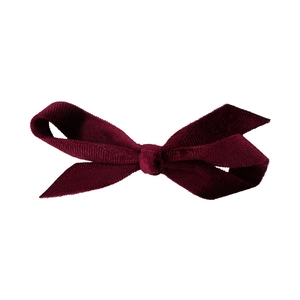 Elegant burgundy velvet bow hair clip with a classic minimalist aesthetic for women