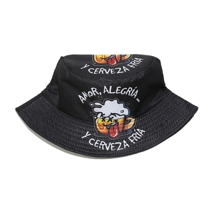 Detail of black canvas bucket hat with beer graphic and Spanish slogan print