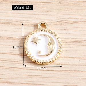 Detailed macro view of 16mm gold celestial pendant with white enamel moon and star