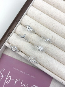 Detailed view of six S925 sterling silver rings with heart and geometric patterns