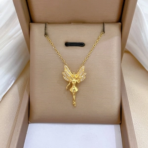 Detailed shot of golden butterfly fairy necklace with sparkling zircons in a jewelry box