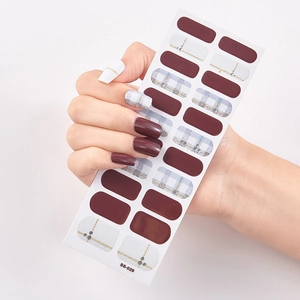 Detail of SS-029 self-adhesive nail stickers featuring deep red and gold grid designs