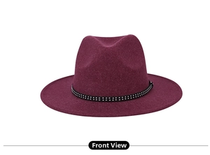 Detail view of the burgundy fedora hat with black rivet trim and wool felt texture