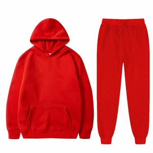 Red sportswear set with hooded sweatshirt and matching joggers in a flat lay display