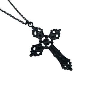 Gothic large black metal cross necklace with intricate filigree details on white background