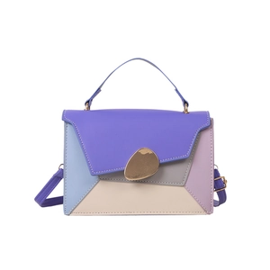 Fashion color-block handbag with geometric patchwork and pebble-shaped gold metal clasp
