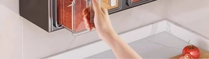 Detail of wall-mounted kitchen seasoning box with transparent drawers and gray casing