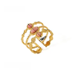 Detail of pink oval gemstones on 18k gold plated wavy band with 2.7g weight info