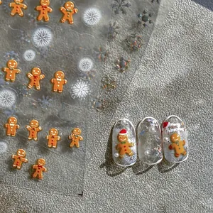 Embossed 5D Christmas nail art stickers featuring gingerbread men and snowflakes to1033