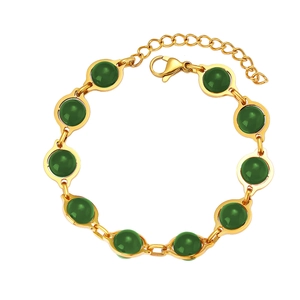 Detail of vintage gold bracelet with round green turquoise beads and lobster clasp