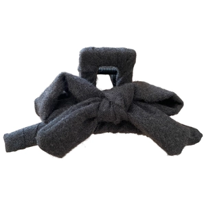 Elegant charcoal grey plush fabric bow hair claw clip with a minimalist vintage design