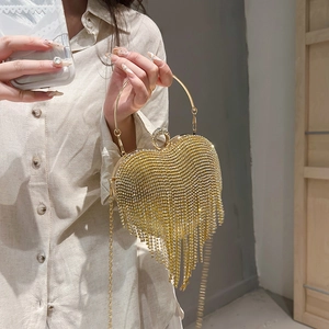 Golden heart-shaped evening bag with tassels, rhinestones and metal chain strap for women