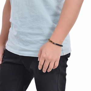 Detail of 6mm map stone and matte beaded bracelet on male wrist with adjustable link