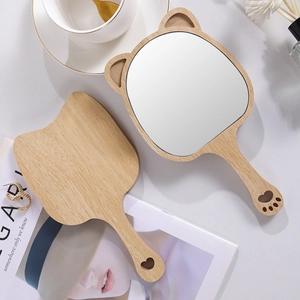 Cat-shaped wooden handheld makeup mirror with paw cutout on handle and natural wood finish