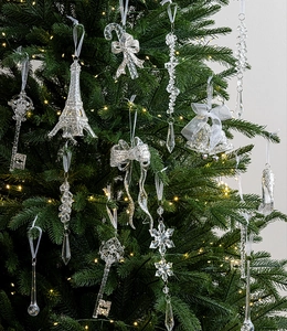 Macro shot of sparkling ice crystal Christmas tree ornaments with silver glitter detail