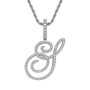 Macro detail of cursive S letter pendant with shimmering cubic zirconia pavé setting