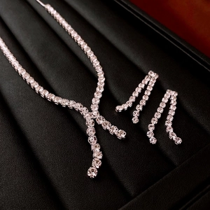 Luxurious silver tassel jewelry set with zircon necklace and dangle earrings on leather