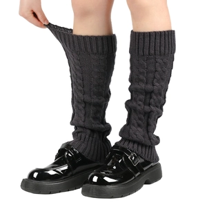 Thick cable knit dark grey leg warmers paired with black leather platform shoes