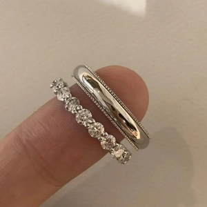 Minimalist S925 silver wedding ring set with eternity pave crystals on a woman's finger