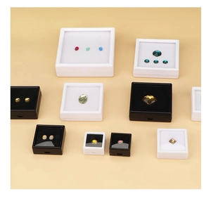 Detailed array of transparent acrylic jewelry boxes with white and black sponge inserts