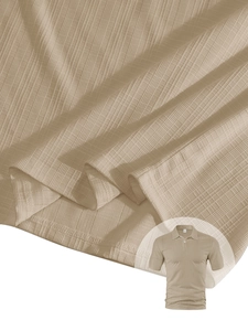 Detailed macro view showing the waffle knit texture of this men beige short sleeve polo shirt