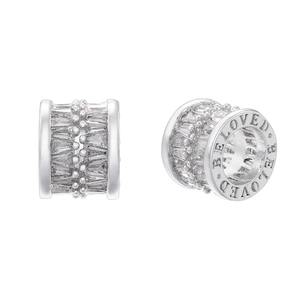 Macro view of silver-plated bead with baguette zircon and 'BELOVED' engraving detail
