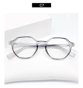 Detail view of octagon purple frame glasses C7 on white leather pouch with modern style