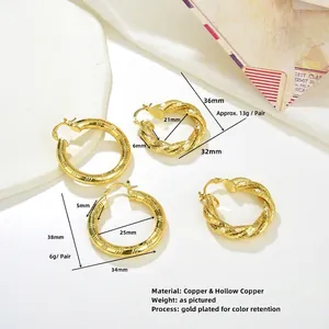 Vintage chunky gold hollow twist hoop earrings for women with textured metal finish