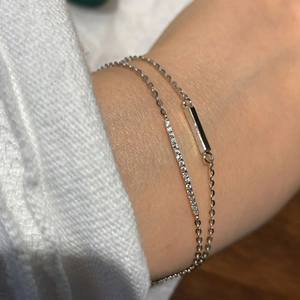 Minimalist double layer silver bracelet with polished bar and row of cubic zirconia