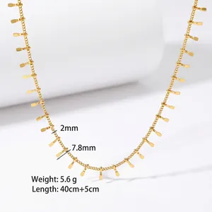 Detailed close-up of 18K gold stainless steel tassel necklace with rectangle charms