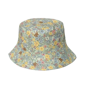Floral print sun hat with vintage blossoms on light green fabric for summer outdoor wear
