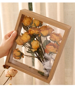 Detailed shadow box frame with dried yellow roses and decorative For You ribbon