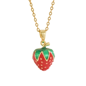 Minimalist gold necklace with red enamel strawberry pendant and green leaves on white background