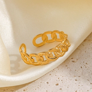 18K gold plated stainless steel chain link ring on a luxury stone and silk background